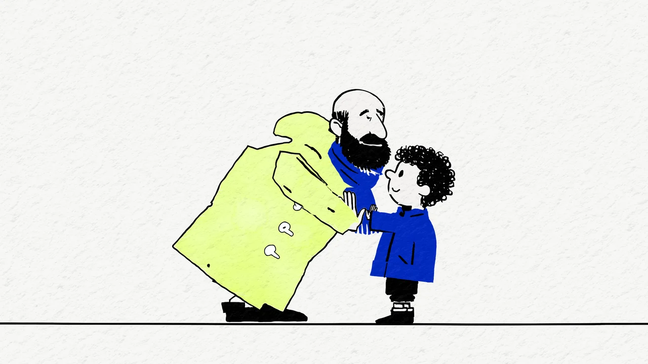 Standbild aus dem Film: Murat beugt sich zu Emir hinunter, sie klatschen sich ab.